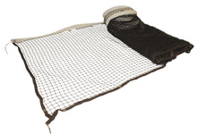 Badminton net partially rolled out on white background