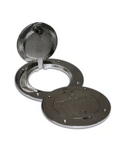 A round, chrome floor plate for a volleyball system, shown both opened and closed.
