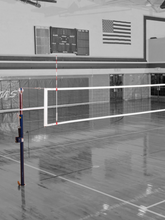 Elite Steel volleyball system in a gym in black and white.