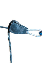 Close-up of a rope rachet in use on a volleyball system with a white background.